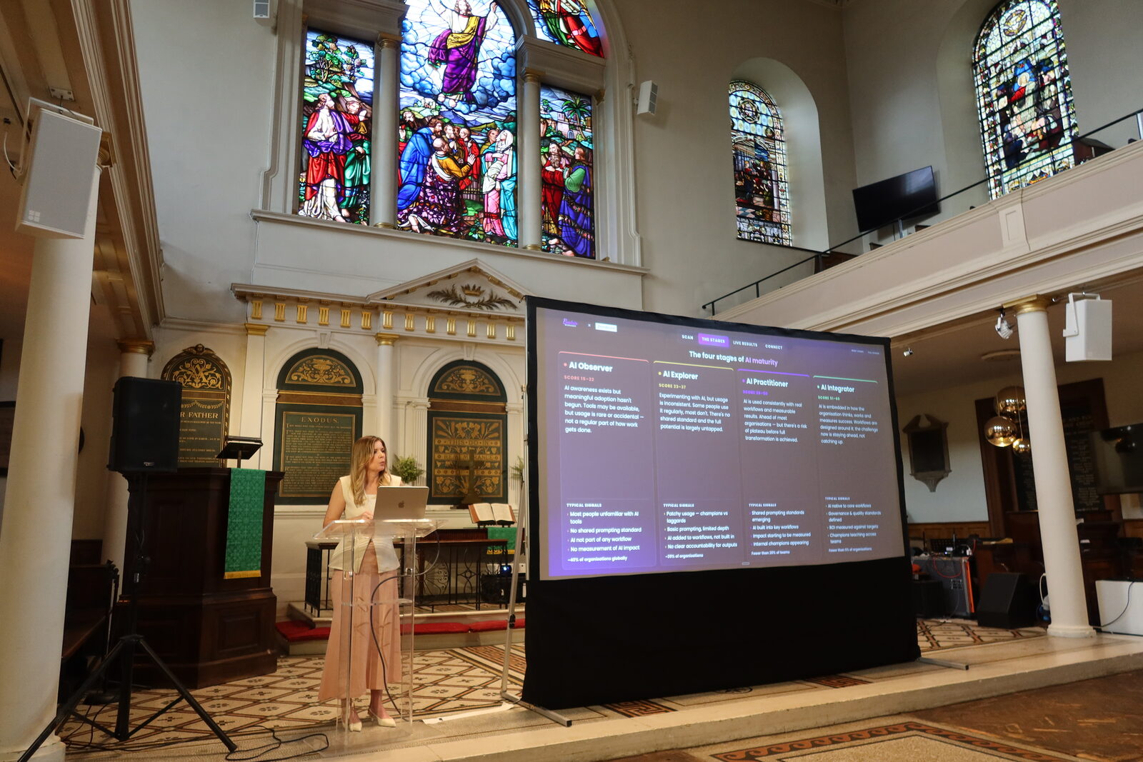Beatrix Meszaros presenting a live AI maturity assessment at the Mindstone London AI Meetup